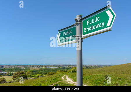 Public Footpath and Public Bridleway sign on a hill at Highdown Hill on the South Downs in West Sussex, England, UK. Stock Photo