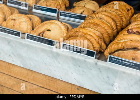 Cornish pasties on display in a bakery shop window in St Ives, Cornwall, England, UK Stock Photo