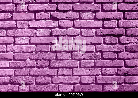 Background of purple brick wall pattern texture. Suitable for graffiti inscriptions as a textured effect on behind Stock Photo
