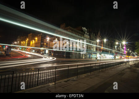Light trails showing some movement on Princes Street in Edinburgh, Scotland Stock Photo