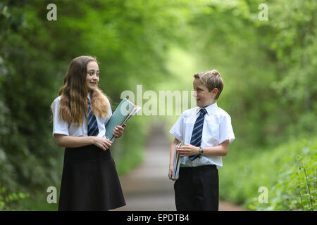 School pupils in uniform walking to school UK Stock Photo