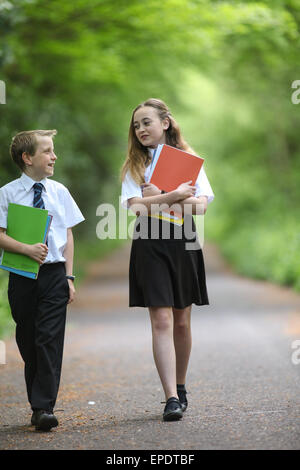 School pupils in uniform walking to school UK Stock Photo