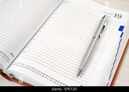 Diary with a pen on a white background closeup Stock Photo
