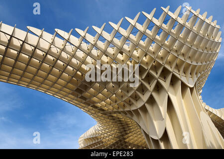 Modern abstract architecture of Metropol Parasol pod at Plaza of the Incarnation Seville Spain against sky