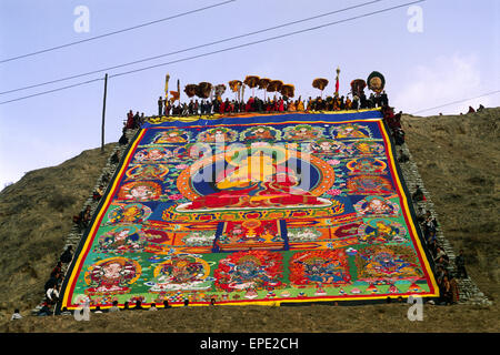 China, Tibet, Qinghai province, Tongren (Repkong), Wutun Si monastery, tibetan new year's day, the big thangka on a hill Stock Photo