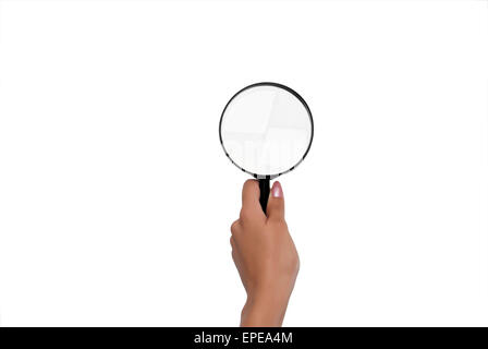 Magnifying glass in a woman's hand Stock Photo