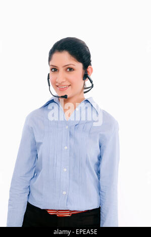 One businesswoman  wearing headphones and smiling Stock Photo