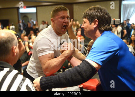 Vancouver, Canada. 17th May, 2015. Arm wrestlers compete during the 2015 Canadian Arm Wrestling Championships in Vancouver, Canada, May 17, 2015. Best Canadian arm wrestlers gathered here to battle for the trophy and champion title. Winners will represent Canada at the 2015 World Armwrestling Championships in September in Kuala Lumpur, Malaysia. © Sergei Bachlakov/Xinhua/Alamy Live News Stock Photo