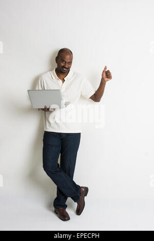 indian matured male with a laptop Stock Photo