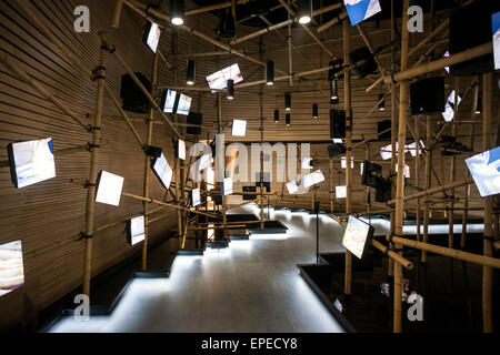 Exhibition hall with irregular arrangement of multimedia screens. Milan Expo 2015, Vanke Pavilion, Milan, Italy. Architect: Dani Stock Photo