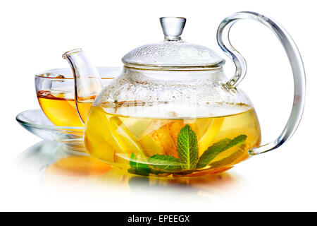 Hot herbal tea with ginger, lemon and mint.  Ginger beverage in transparent teapot. Stock Photo