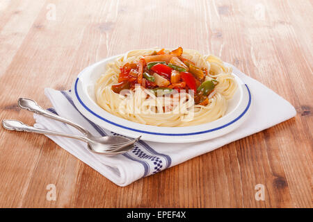 Spaghetti pasta with tomato sauce and steamed vegetables. Healthy pasta eating. Stock Photo