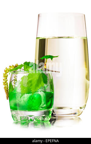 A glass of birch sap. Fresh, clean look. Birch juice in elegant highball glass decorated with tiny birch branch with leaves Stock Photo