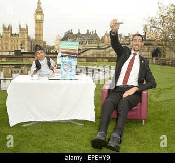 The shortest man ever Chandra Bahadur Dangi 54.6com - 21.5 inches) and the tallest living man Sultan Kosen 251cm - 8ft 3 inches) meet for the first time in London to mark the tenth annual Guiness world records day, who is celebrating their 60th anniversary.  Featuring: Sultan Kosen,Chandra Bahadur Dangi Where: London, United Kingdom When: 13 Nov 2014 Credit: Euan Cherry/WENN.com Stock Photo