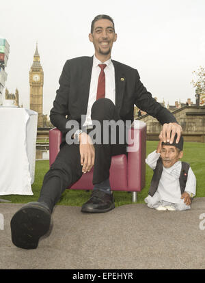 The shortest man ever Chandra Bahadur Dangi 54.6com - 21.5 inches) and the tallest living man Sultan Kosen 251cm - 8ft 3 inches) meet for the first time in London to mark the tenth annual Guiness world records day, who is celebrating their 60th anniversary.  Featuring: Sultan Kosen,Chandra Bahadur Dangi Where: London, United Kingdom When: 13 Nov 2014 Credit: Euan Cherry/WENN.com Stock Photo