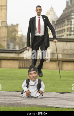 The shortest man ever Chandra Bahadur Dangi 54.6com - 21.5 inches) and the tallest living man Sultan Kosen 251cm - 8ft 3 inches) meet for the first time in London to mark the tenth annual Guiness world records day, who is celebrating their 60th anniversary.  Featuring: Sultan Kosen,Chandra Bahadur Dangi Where: London, United Kingdom When: 13 Nov 2014 Credit: Euan Cherry/WENN.com Stock Photo