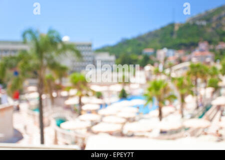 Defocused background of summer hotel with palm trees Stock Photo