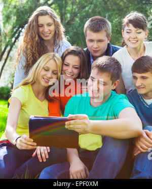 Young college students using tablet computer Stock Photo