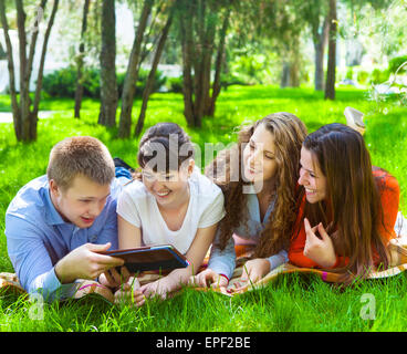 Young college students using tablet computer Stock Photo