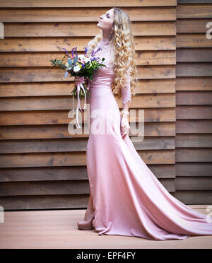 Bride holding the wedding bouquet with succulent flowers Stock Photo
