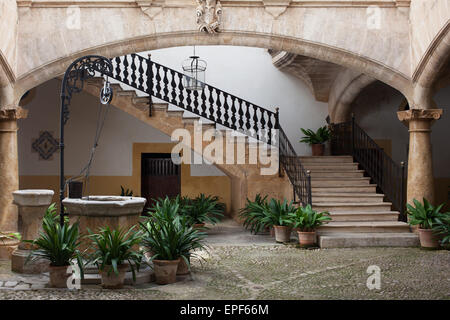 Cozy european patio with well and stairs Stock Photo