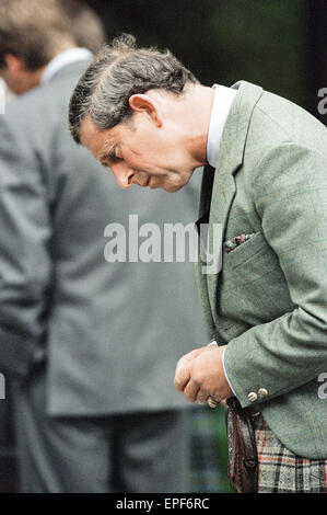 Royal Family, Balmoral Estate, Scotland, 5th September 1997.   After attending a private service at Crathie Church, Royal family stop to look at floral tributes left for Princess Diana, at the gates of Balmoral Castle.  Prince Charles Stock Photo