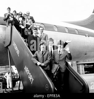 Northern premier of The Beatles film 'A Hard Day's Night'. John Lennon, Paul McCartney, Ringo Starr and George Harrison pictured on the steps of the plane in Liverpool on 10th July 1964. Stock Photo