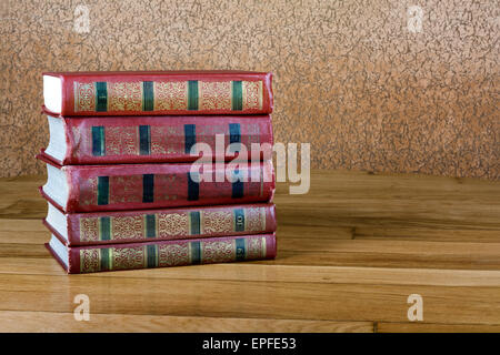 Pile of old books on a beautiful wooden table Stock Photo