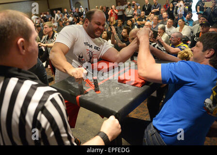 Vancouver, Canada. 17th May, 2015. Arm wrestlers battle during the 2015 Canadian Arm Wrestling Championships in Vancouver, Canada, May 17, 2015. Best Canadian arm wrestlers, including world champions, gathered here to battle for a trophy and champion title. Winners will represent Canada at the 2015 World Armwrestling Championships in September in Kuala Lumpur, Malaysia. © Sergei Bachlakov/Xinhua/Alamy Live News Stock Photo