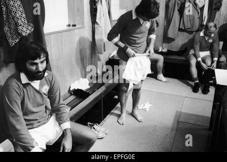 Former Manchester United footballer George Best in reflective mood as he puts on the United jersey again before the Mike Summerbee testimonial match. 30th August 1975. Stock Photo