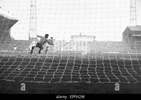 Manchester United v Manchester City, league match at Old Trafford, Wednesday 27th March 1968. Final Score: Man Utd 1-3 Man City.  Only 38 seconds gone - George Best lashes the ball past goalkeeper Ken Mulhearn. Stock Photo