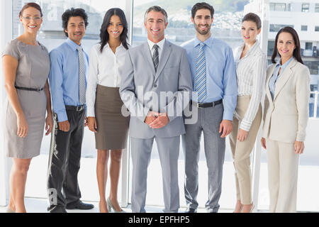 Happy workers standing all together Stock Photo