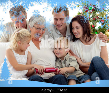 Composite image of brother and sister pulling crackers in christmas Stock Photo