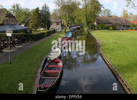 Boats moored along main canal in the popular tourist village of Giethoorn - 'Venice of the North' -  Overijssel, The Netherlands Stock Photo