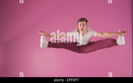 Cool break dancer mid air doing the splits Stock Photo