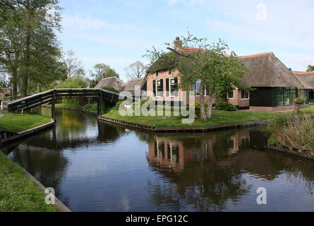 Wooden bridge over the main canal in the popular tourist village of Giethoorn, Overijssel, The Netherlands Stock Photo