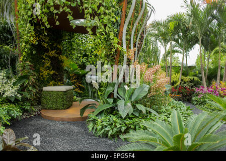 2015 RHS Chelsea Flower Show Press Day, Royal Hospital Chelsea, London, UK. 18th May, 2015. The Hidden Beauty of Kranji by Esmond Landscape and Uniseal garden, designed by John Tan and Raymond Toh, set in a tropical environment and features plants commonly found in the Singapore suburb of Kranji. Credit:  Malcolm Park editorial/Alamy Live News Stock Photo