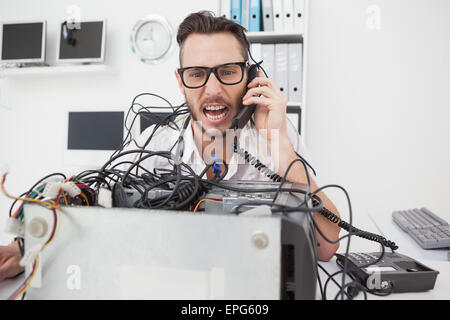 Angry computer engineer making a call Stock Photo - Alamy