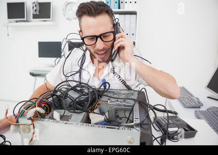 Angry computer engineer making a call Stock Photo - Alamy