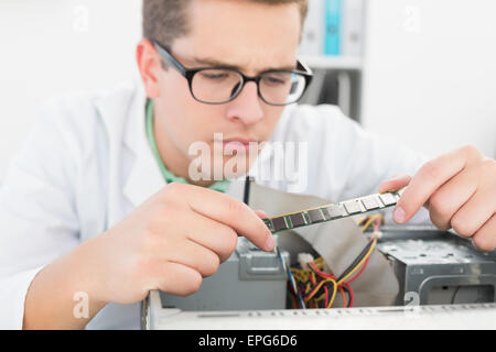 Technician working on broken cpu Stock Photo