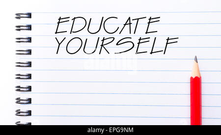 Educate Yourself Text written on notebook page, red pencil on the right. Motivational Concept image Stock Photo