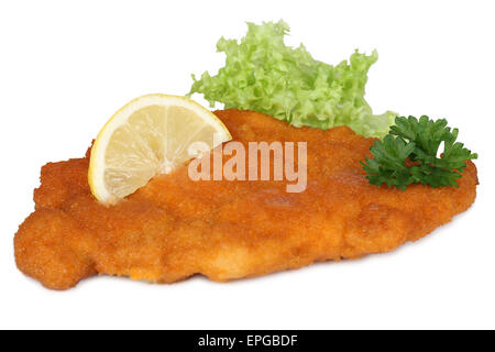 Wiener Schnitzel mit Zitrone und Salat isoliert Stock Photo