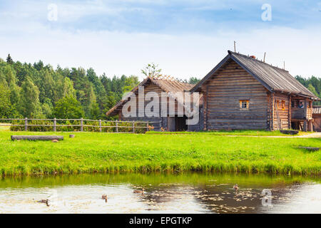 Russian wooden architecture example, old rural houses on the lake coast Stock Photo