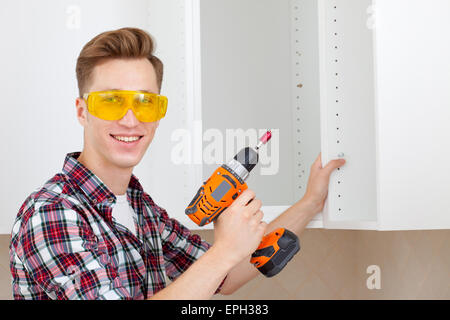 smiling worker with rock-drill Stock Photo