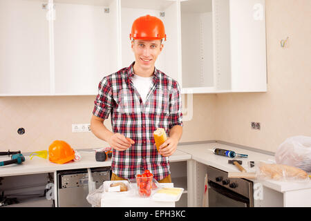 repairman dines Stock Photo