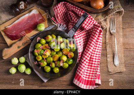 Honey caramelized brussels sprouts with ham Stock Photo