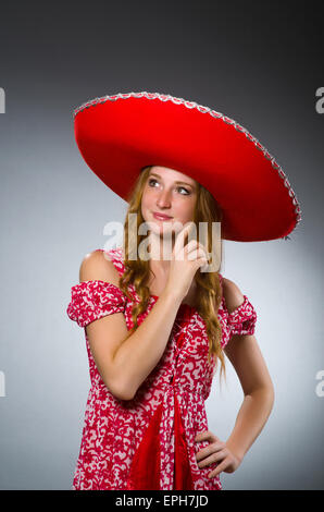 Mexican woman wearing a mariachi hat. Woman with sombrero, white