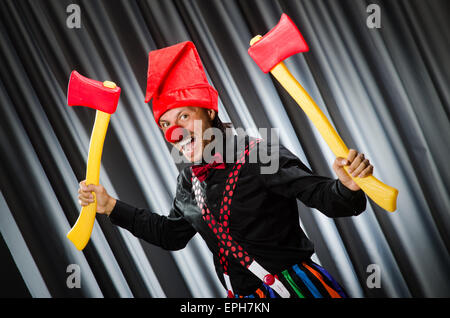 Funny clown with red axe Stock Photo