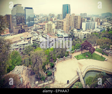 Retro stylized photo of Santiago de Chile downtown, modern skyscrapers mixed with historic buildings, Chile. Stock Photo