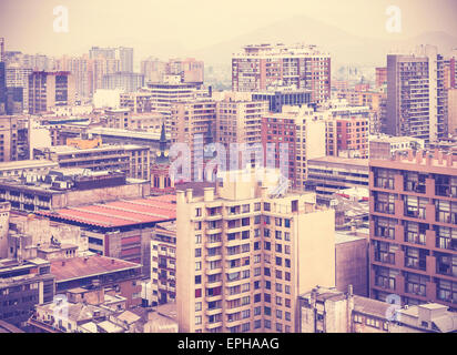 Vintage stylized photo of Santiago de Chile downtown, modern skyscrapers mixed with historic buildings, Chile. Stock Photo